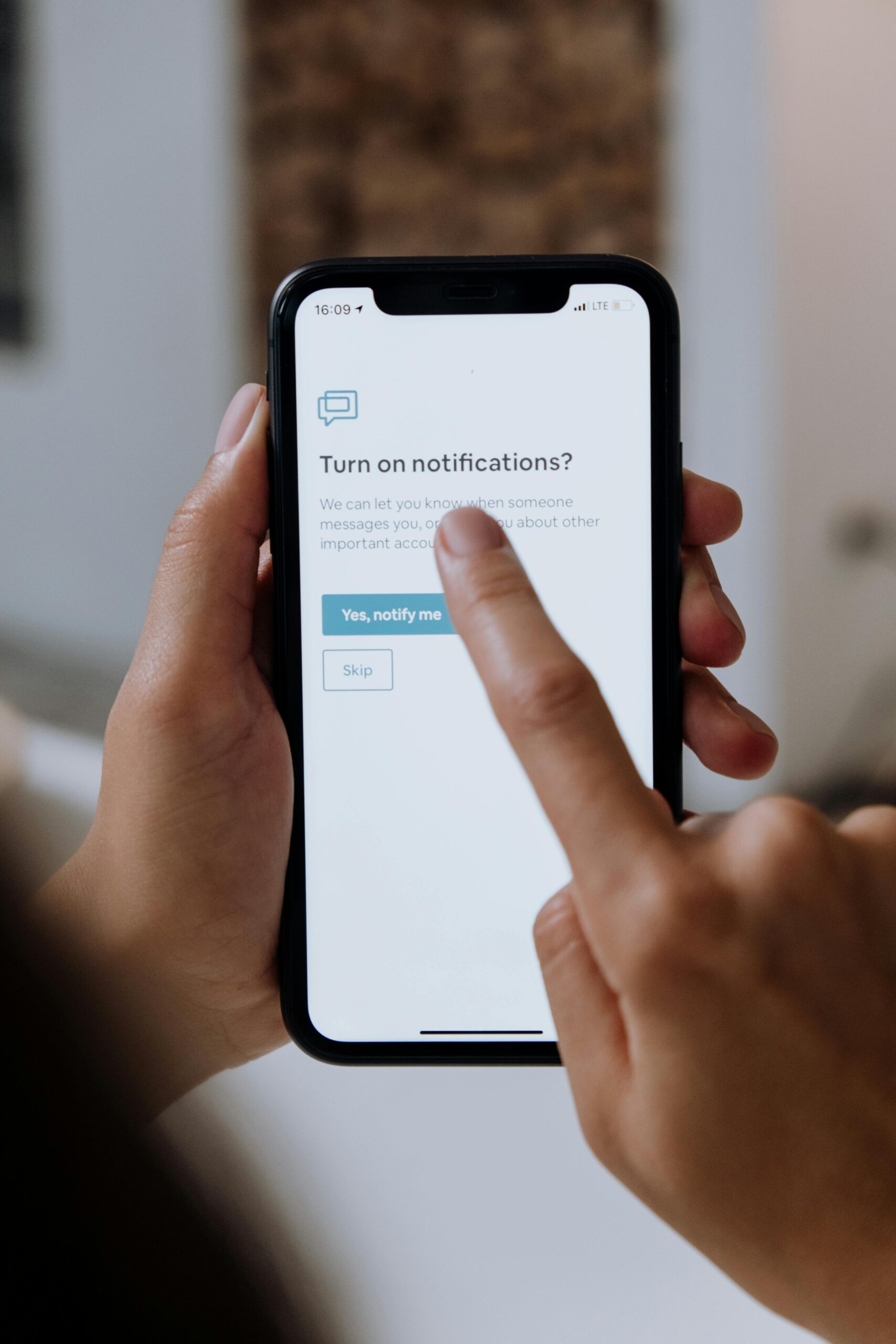 A client checking her phone