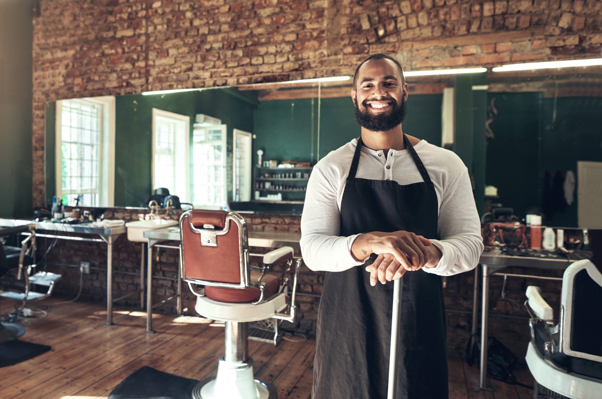 A barbershop owner in his shop