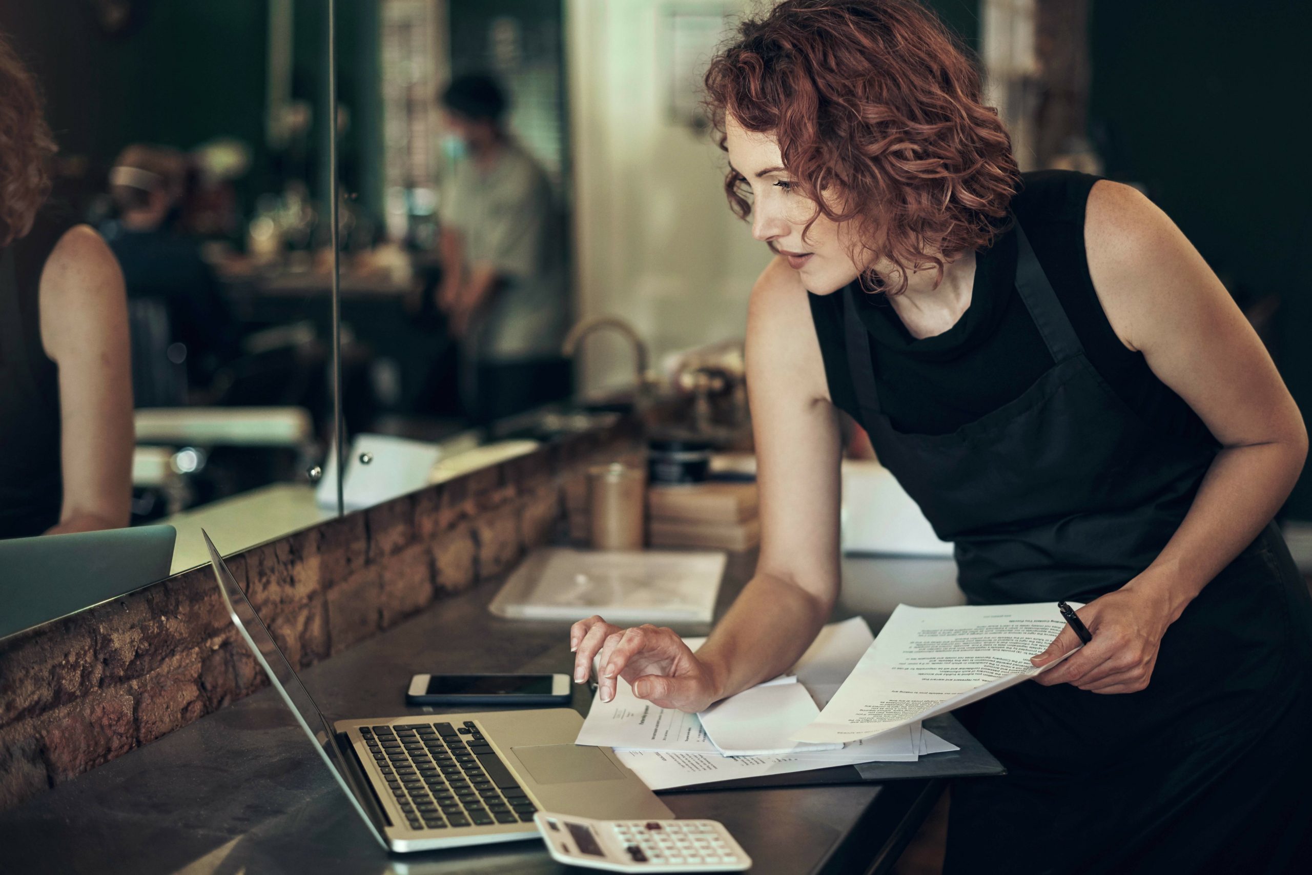 A salon manager working through admin
